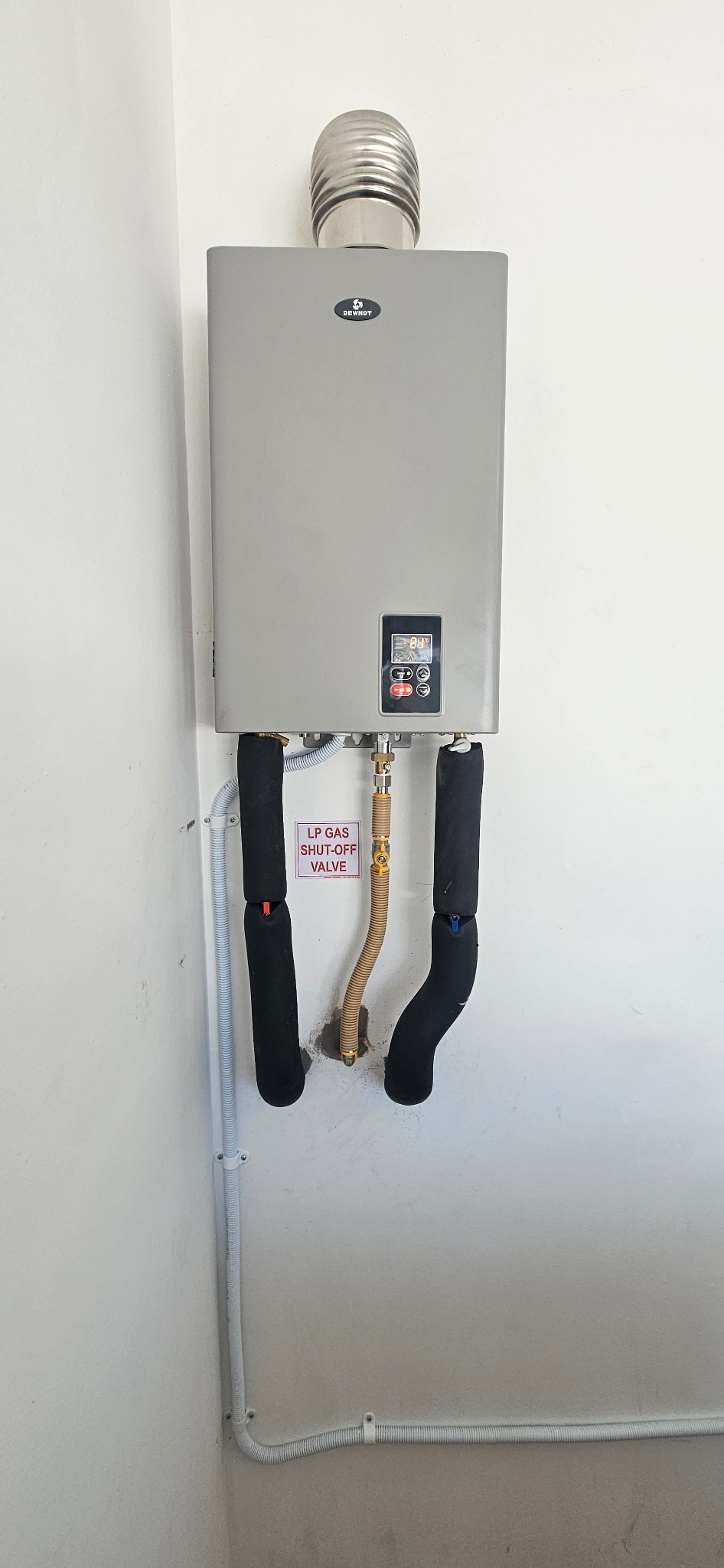 Indoor Dewhot gas geyser and pipework