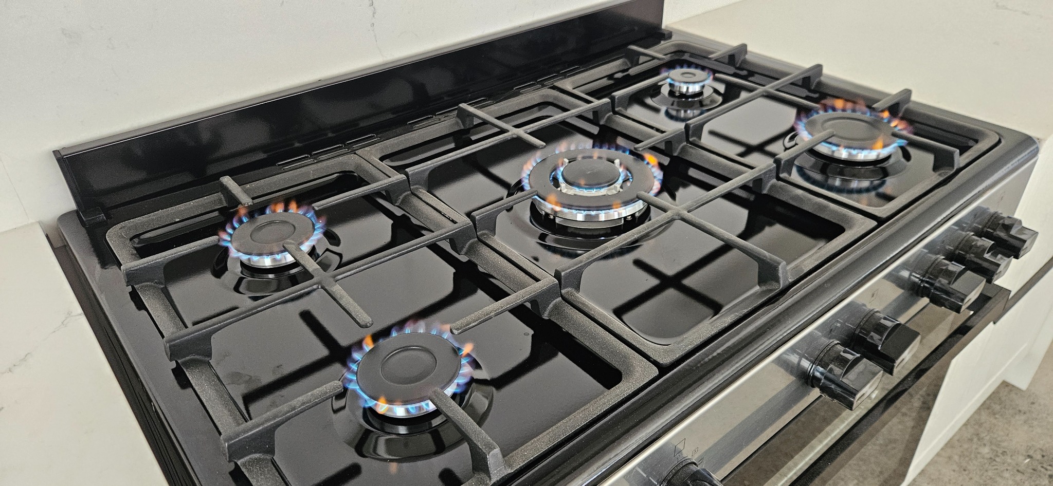 Gas stove with lit burners